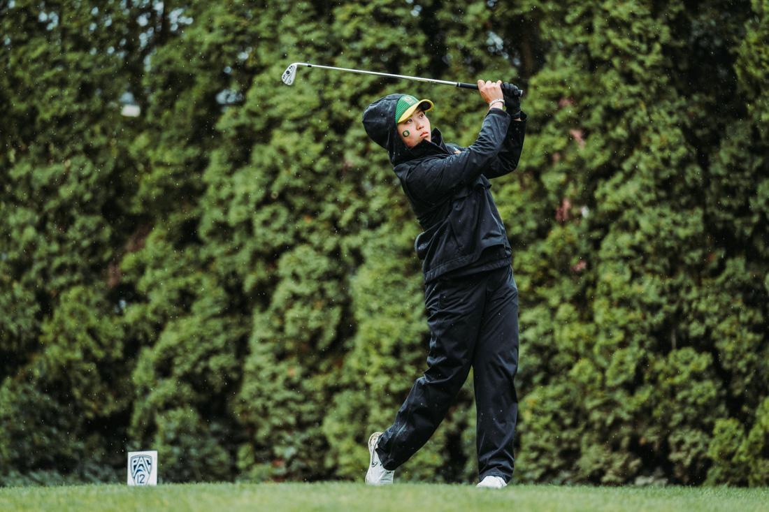 Oregon's Hsin-Yu (Cynthia) Lu, uses an iron for her approach shot on a Par-3 hole. The Eugene Country Club hosted the Pac-12 Women's golf championships from April 18-20, 2022. (Serei Hendrie/ Emerald)