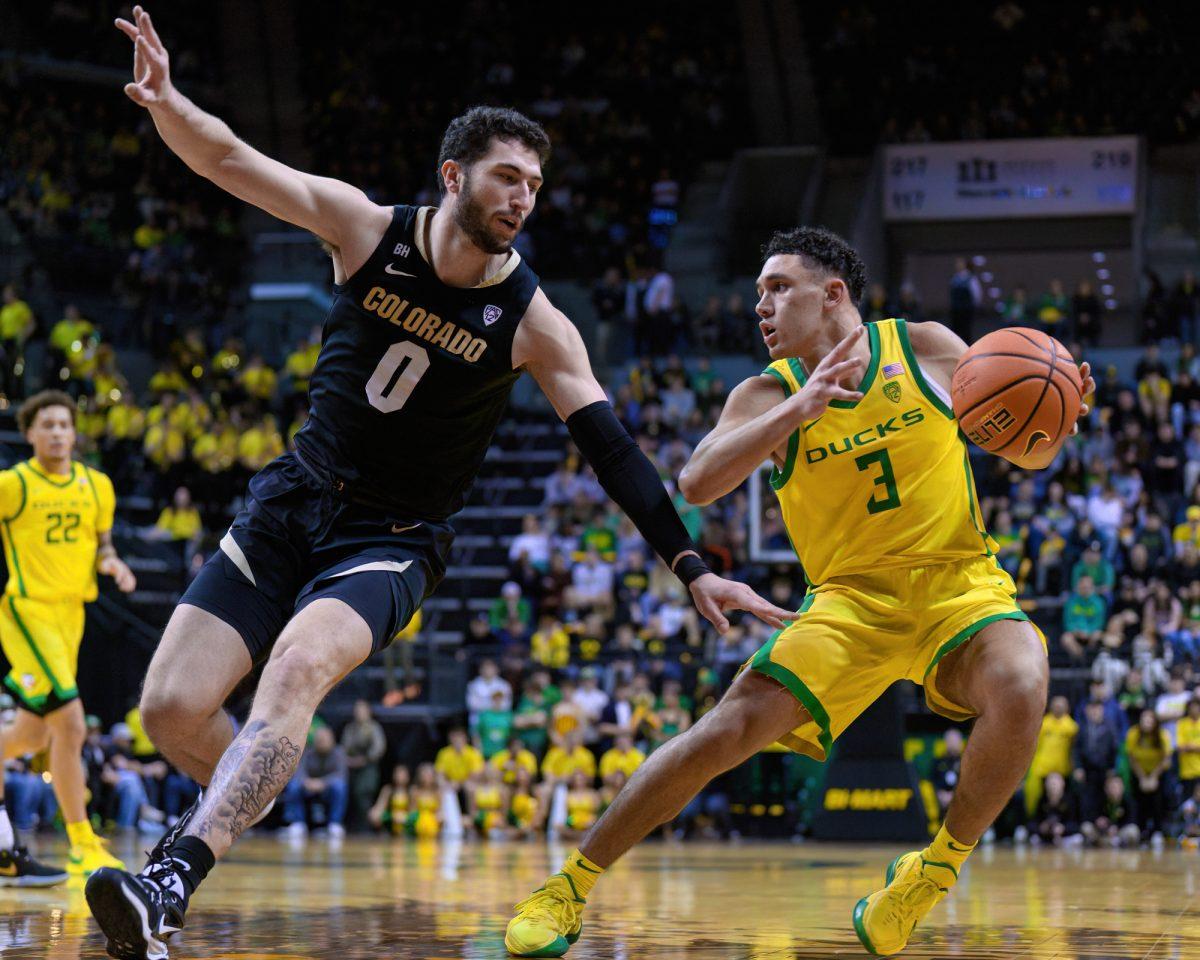 Oregon Guard Jackson Shelstad #3 (right) evades Colorado Guard Luke O'Brien #0 (left) as he pushed towards the basket. The University of Oregon Ducks Men's Basketball team was defeated by the University of Colorado Buffaloes 79-75 in a home game at Matthew Knight Arena in Eugene, Ore., on March 7, 2024. (Eric Becker/Emerald)