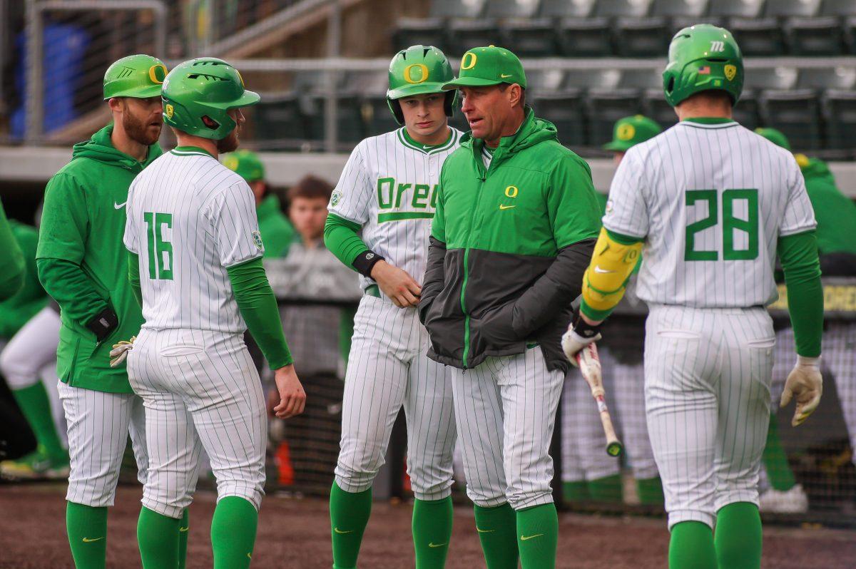 Oregon&#8217;s coach Mark Wasikowski talking to the baserunners during a pitching change. Oregon Baseball take on UC Santa Barbara at PK Park in Eugene, on March 3 , 2024. (Eddie Bruning/Emerald)