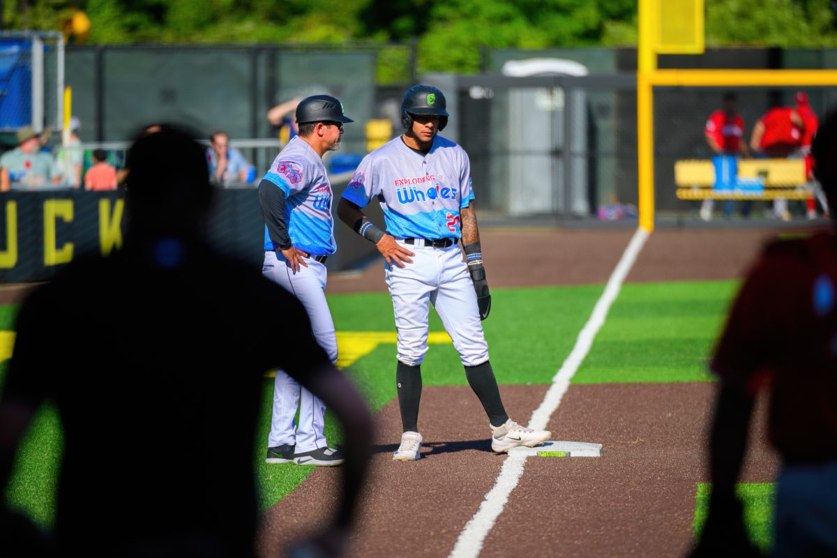 Victor Bericoto (right) recives advice from Carlos Valderrama at third base. The Eugene Emeralds finish their homestand with a win against the Vancouver Canadians by a final score of 6-4 at P.K. Park in Eugene, Oregon, on June 25, 2023. (Eric Becker/Emerald)