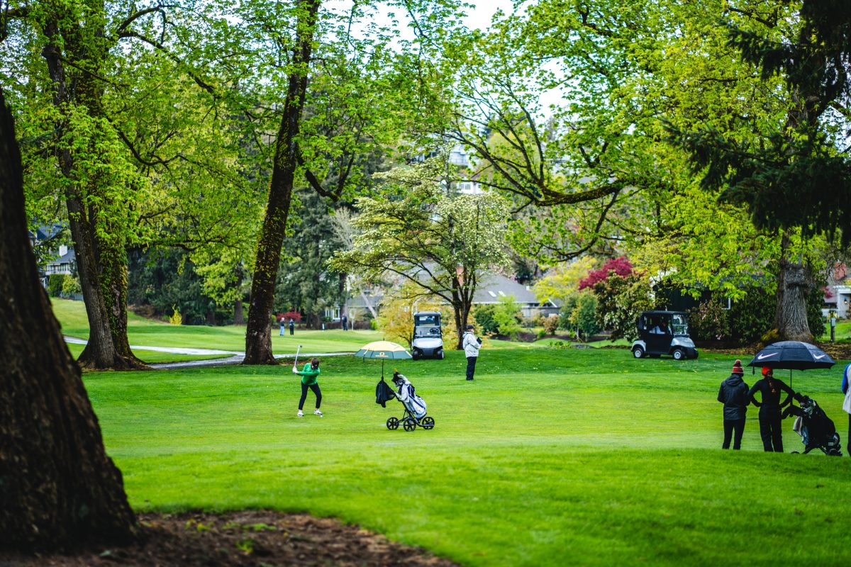 A golfer for the University of Oregon hits the ball towards the green.&#160;The Eugene Country Club hosted the Pac-12 women's golf championships from April 18-20, 2022. (Will Geschke/Emerald)