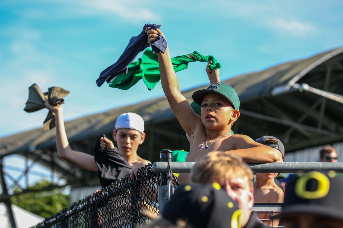 Young Oregon fans cheer on the Ducks. Oral Roberts defeats the Oregon Baseball team in game 2 of Super Regionals on June 10th at PK Park. (Kai Kanzer/Emerald)