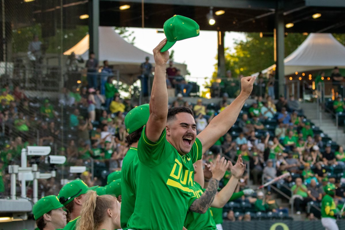 Ducks Logan Mercado (20) celebrates homerun hit by Mason Neville (26). The Oregon Ducks baseball team takes on the Washington State Cougars on May 16, 2024 at PK Park in Eugene, Ore. (Mason Burbey/Emerald)