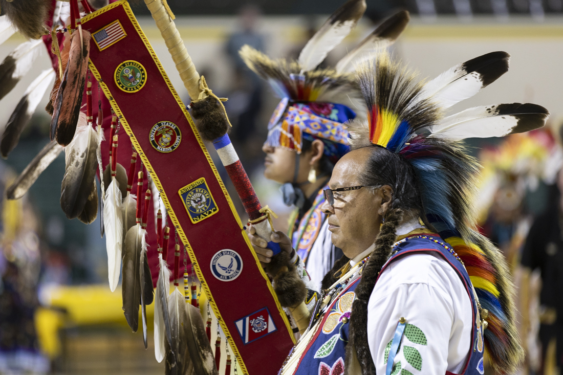 People enter the powwow during the Grand Entry on May 11, 2024. The 56th annual Mother's Day Powwow saw its second and final day, with the crowning of new UO Indigenous Cultural Ambassadors, dance contests and a Missing and Murdered Indigenous Women special dance, organized by the Indigenous Women and Marginalized Genders Wellness Group. (Alex Hernandez/Emerald)