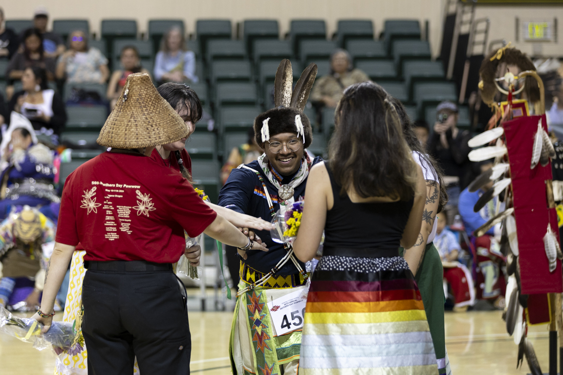 Co-directors of the Native American Student Union smile after being honored on the first day of the 56th annual Mother's Day Powwow on May 10, 2024. (Alex Hernandez/Emerald)