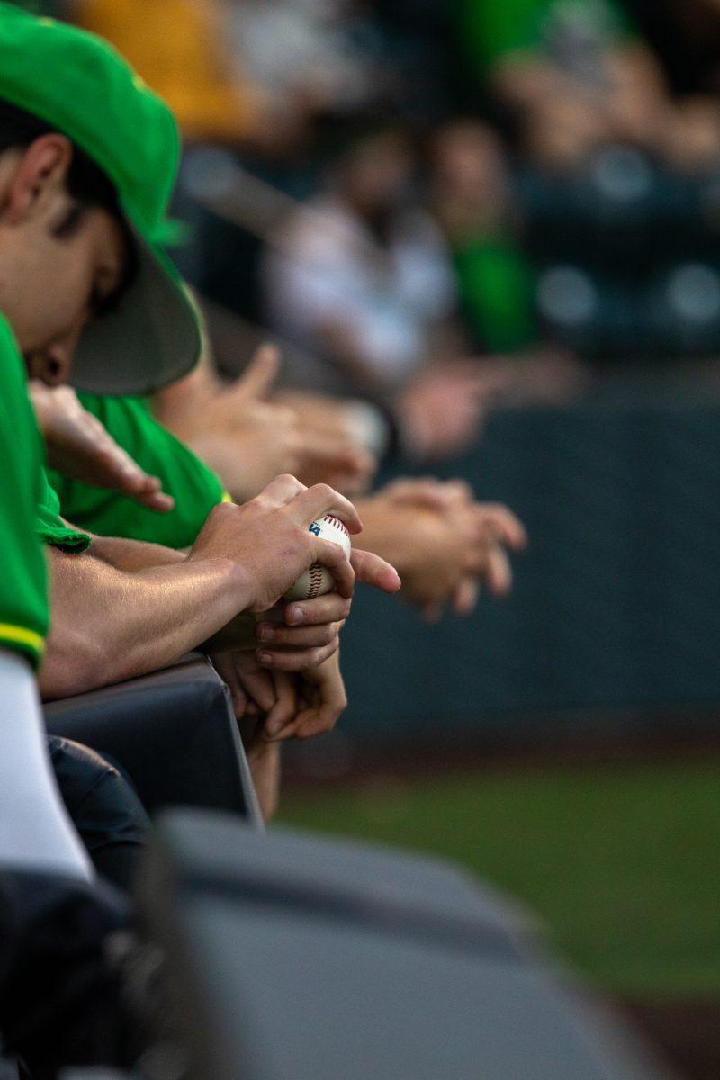 Fidgeting with a baseball is a must during a game. The Oregon Ducks baseball team takes on the Washington State Cougars on May 16, 2024 at PK Park in Eugene, Ore. (Mason Burbey/Emerald)