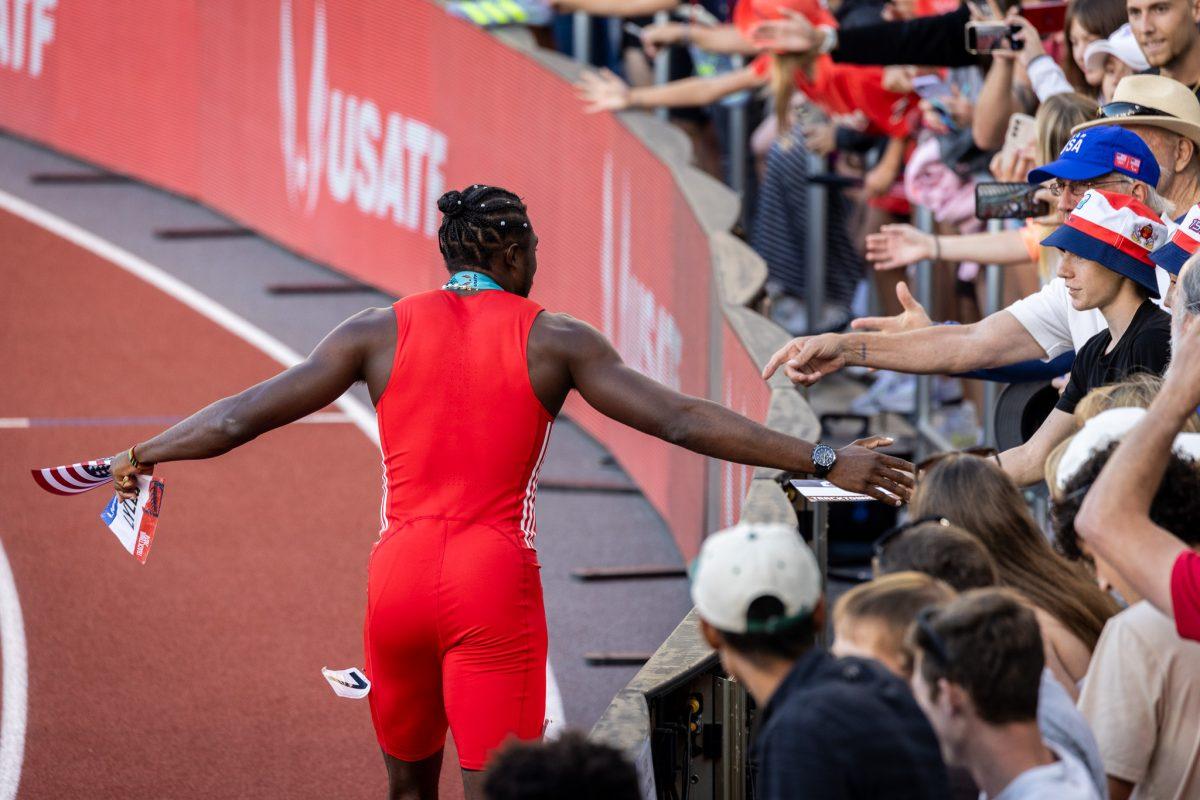 Noah Lyles makes sure to high five every fan waiting at the perimeter of the track as he celebrates a world leading time for the year to become the US Olympic Trials Champion in the men's 100m.&#160;The most elite athletes in the country meet at Hayward Field for the 2024 Summer Olympic Trials in Eugene, Ore. on June 22, 2024. (Jonathan Suni/Emerald)