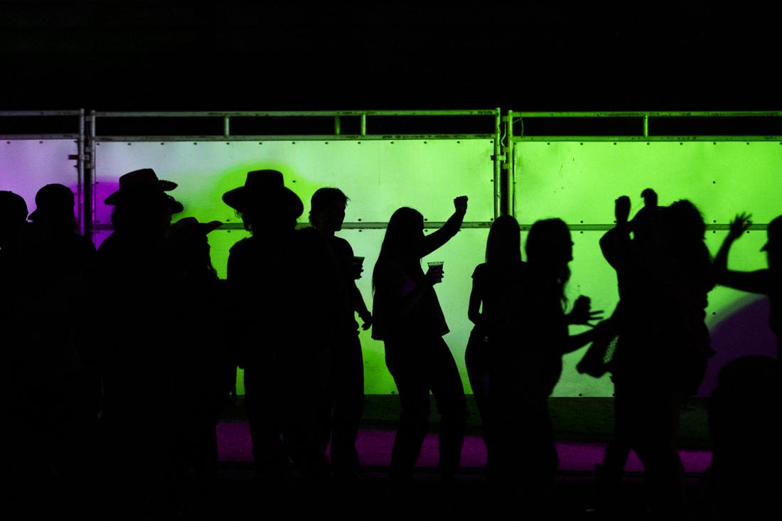 People dance after the events and fireworks at the rodeo on July 3, 2024. The Eugene Pro Rodeo kicked off its first day with the theme of "Tough Enough to Wear Pink," in support of cancer awareness. (Alex Hernandez/Emerald)