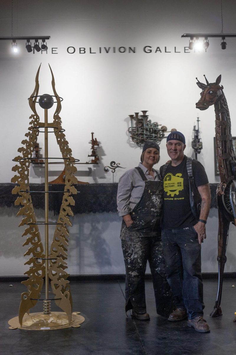 Renee Mahni and Jud Turner pose in The Oblivion Gallery, unveiled August 3. Turner said that the studio provided him and his wife, Renee Mahni, a place for people to experience their sculptures. They plan to host a guest artist in the gallery the first Saturday of each month. (Miles Cull/Emerald)