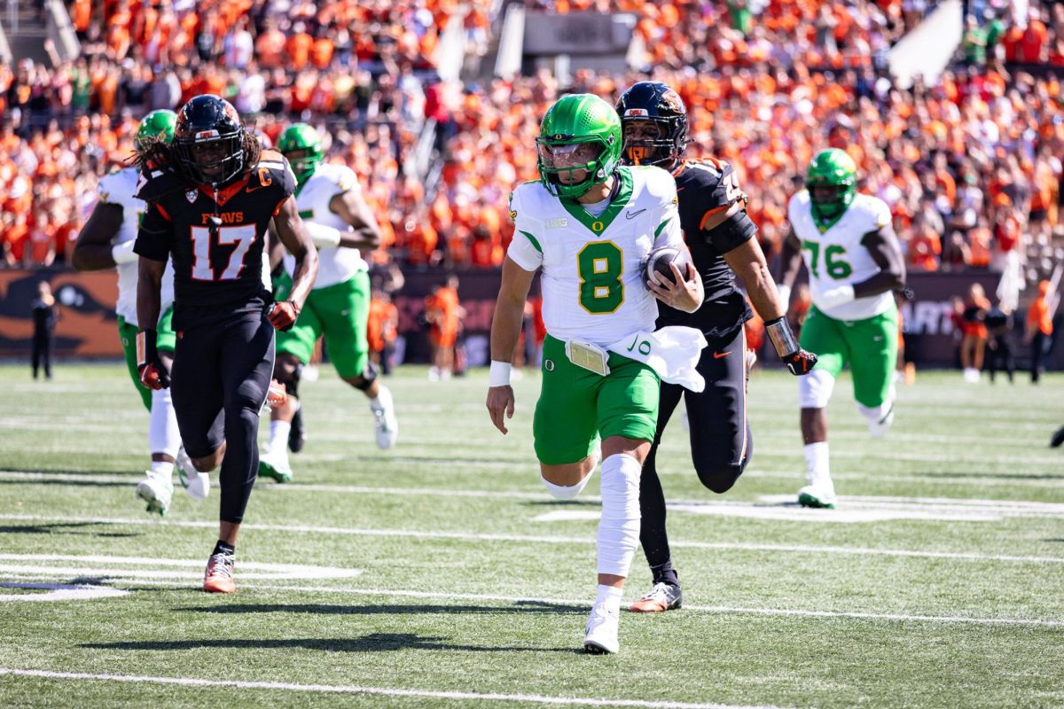 Dillon Gabriel (8) shows off some of his rushing capabilities that caught the eyes of the coaching staff at the UO. The Oregon Ducks travel up to Corvallis to face their in-state rival the Oregon State Beavers on September 14th, 2024. (Jonathan Suni, Emerald)