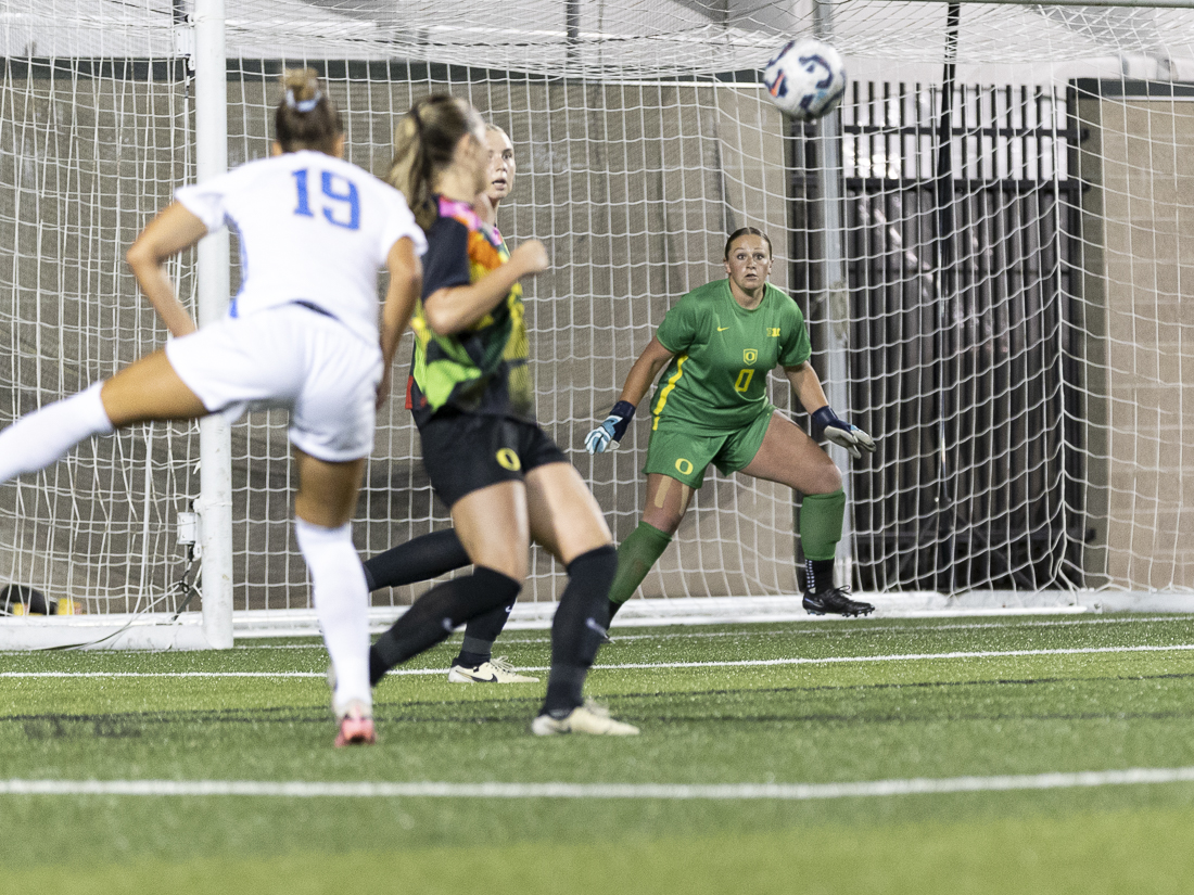 Maddy Goldberg (0), the Oregon goalkeeper, watches the ball as it comes toward her during the women's soccer game on Sept. 14, 2024. The UCLA women's soccer team triumphed over the Oregon Ducks with a 2-1 win during their faceoff at Papé Field. (Alex Hernandez/Emerald)