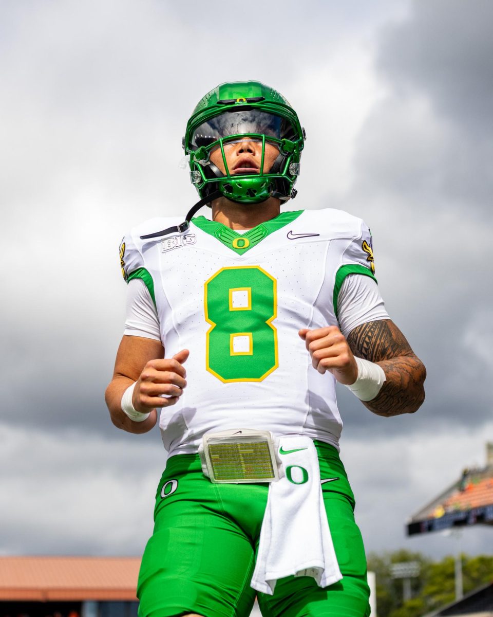 The Beaver fans shower Dillon Gabriel with "boos" and yells as he steps on the field to warm up. The Oregon Ducks travel up to Corvallis to face their in-state rival the Oregon State Beavers on September 14th, 2024. (Jonathan Suni/ Emerald)