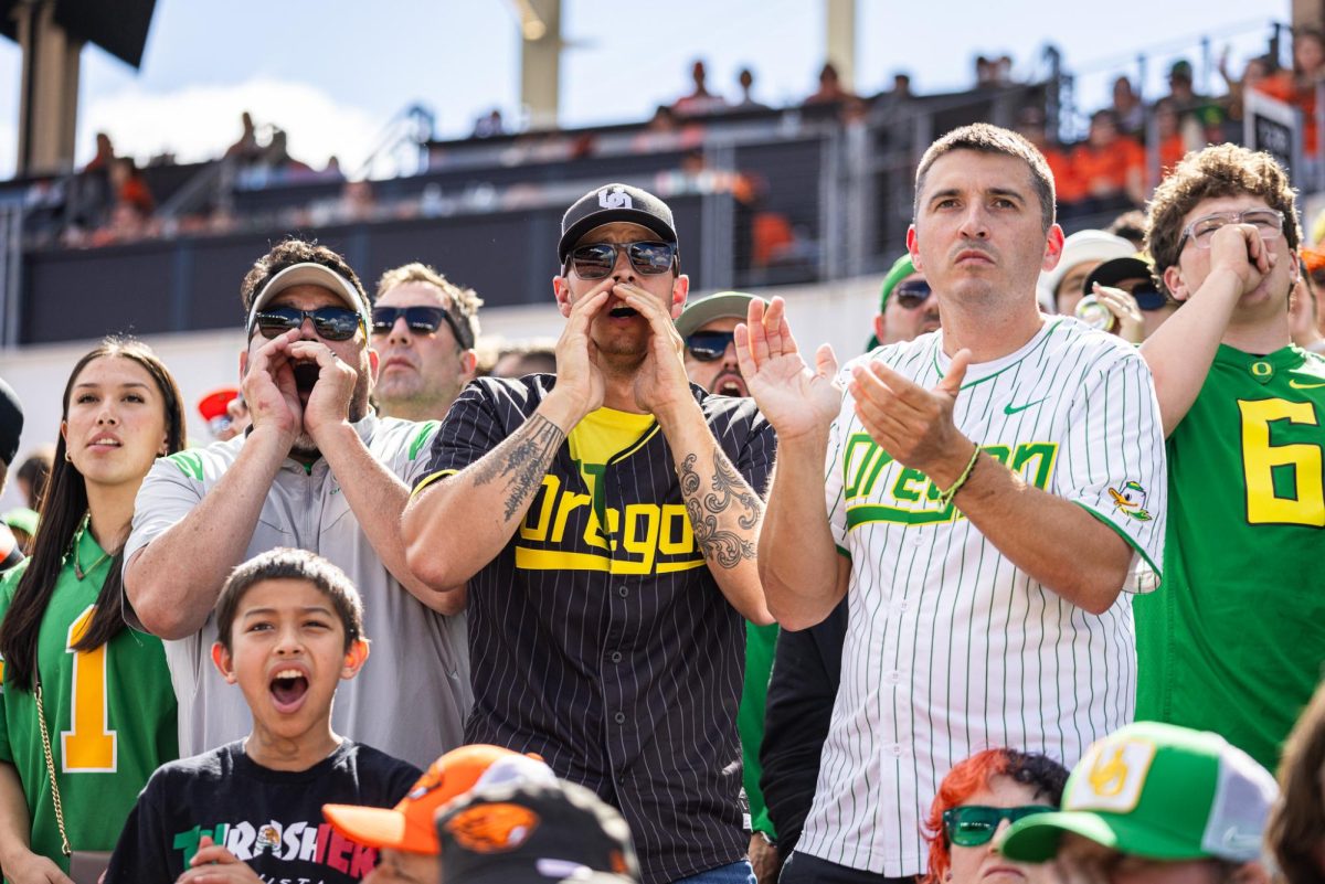 Oregon fans cheer as they look to their defense to come up with a 3rd down stop against the rival Beavers. The Oregon Ducks travel up to Corvallis to face their in-state rival the Oregon State Beavers on September 14th, 2024. (Jonathan Suni/ Emerald)