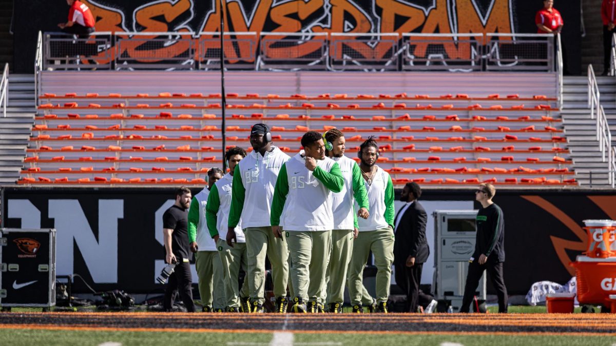 The defensive line walks to center field to join in a prayer circle prior to the team warm up. The Oregon Ducks travel up to Corvallis to face their in-state rival the Oregon State Beavers on September 14th, 2024. (Jonathan Suni/Emerald)