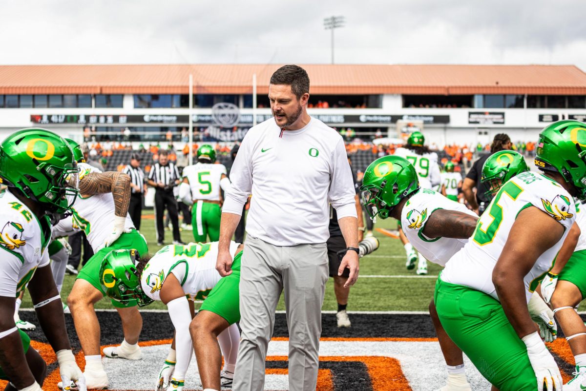 Dan Lanning hypes his Ducks up during team stretches as he looks to get his team in the right mindset before the start of the game. The Oregon Ducks travel up to Corvallis to face their in-state rival the Oregon State Beavers on September 14th, 2024. (Jonathan Suni/Emerald)