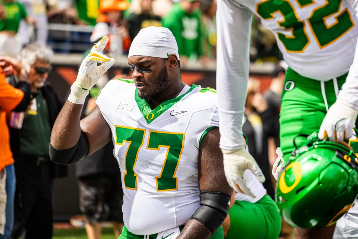 Inching closer towards his Duck debut, recent transfer Matthew Bedford (77) has been fighting through a lingering injury that he suffered early during fall camp. The Oregon Ducks travel up to Corvallis to face their in-state rival the Oregon State Beavers on September 14th, 2024. (Jonathan Suni/Emerald)