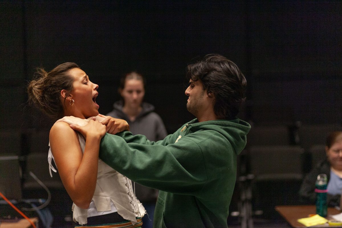 Landon Kobz, playing the creature, works with Izzie Holmes, playing the creature's bride during a choreography call. The University of Oregon Frankenstein play will open November 8th. (Miles Cull/Emerald)