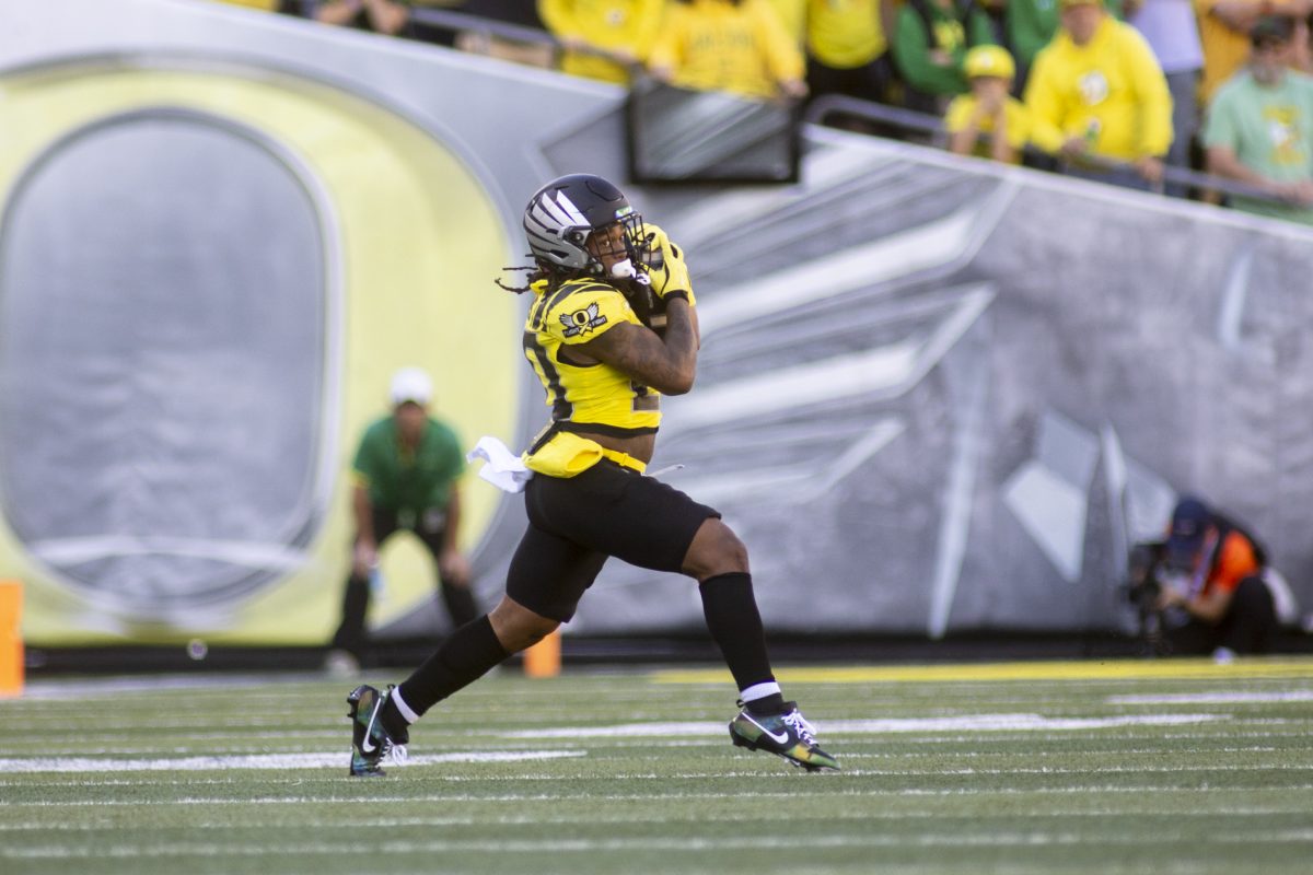 Oregon running back Jordan James (20) runs with the ball during the game on Oct. 26, 2024. The No. 1 Oregon Ducks beat the No. 20 Illinois Fighting Illini 38-9. (Alex Hernandez/Emerald)