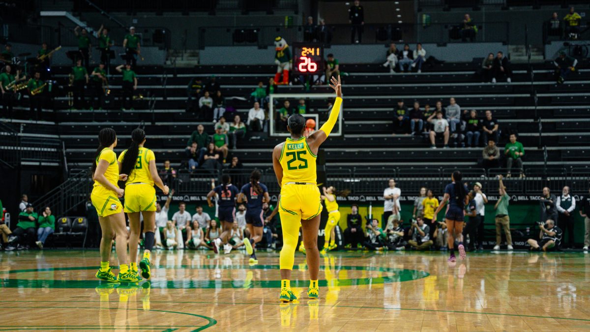 Deja Kelly (25) celebrates in anticipation her long-range pass to  Peyton Scott (10) connects for a layup at Matthew Knight Arena in Eugene, Ore. on Nov. 20, 2024 (Jordan Martin/Emerald)