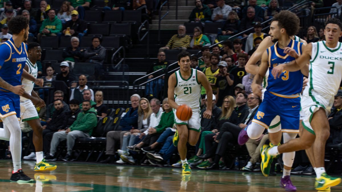 Brandon Angel, a forward for the Oregon Ducks Mens Basketball, driving towards the basket in an attempt to score. (Saj Sundaram/Emerald)