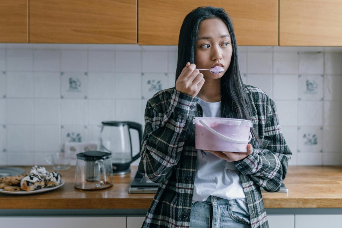 https://www.pexels.com/photo/sad-woman-eating-ice-cream-6643006/