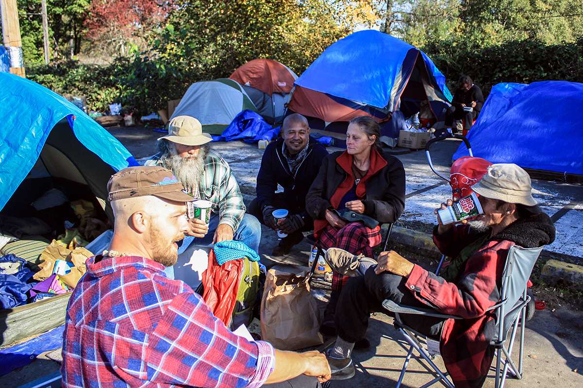 Whoville participants gather over food and drinks to discuss inventory and tasks ahead.