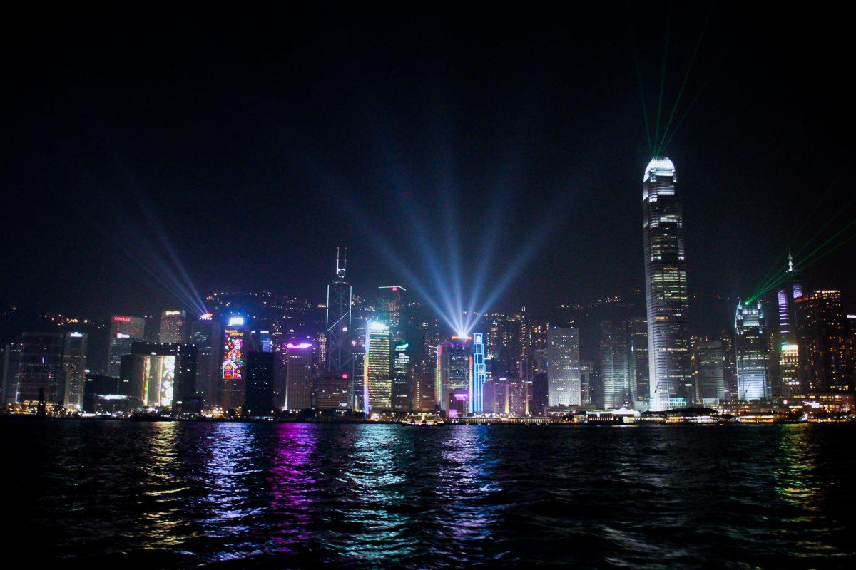 Aboard a ferry on Victoria Harbour, panoramic skylines from Hong Kong Island and Kowloon illuminate the night sky. A symphony of lights, a nightly show, projects colorful lights and laser beams from buildings on both sides of the harbor for the city to enjoy.