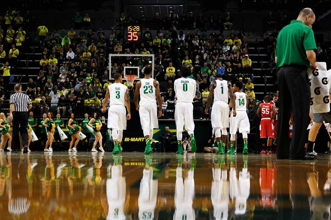 The Oregon basketball team walks onto the floor after a timeout during the second half. The Oregon Ducks play the Utah Utes at Matthew Knight Arena in Eugene, Oregon on February 22, 2015. (Ryan Kang/Emerald)