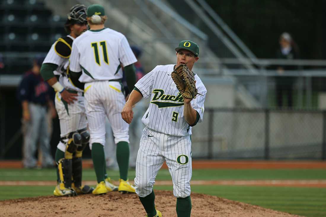 <p>Oregon outfielder Scott Heineman (9) catches a ball from his teammate. The Oregon Ducks play the Gonzaga Bulldogs at P.K. Park in Eugene, Oregon on May 13, 2015. (Eve Hess/Emerald)</p>