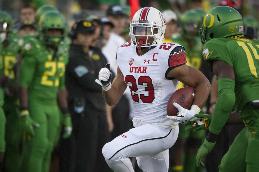 Utah Utes running back Devontae Booker (23) turns the corner towards the end zone. The No. 13 Oregon Ducks face No. 18 Utah in Eugene Oregon on September 26, 2015. (Cole Elsasser/Emerald)