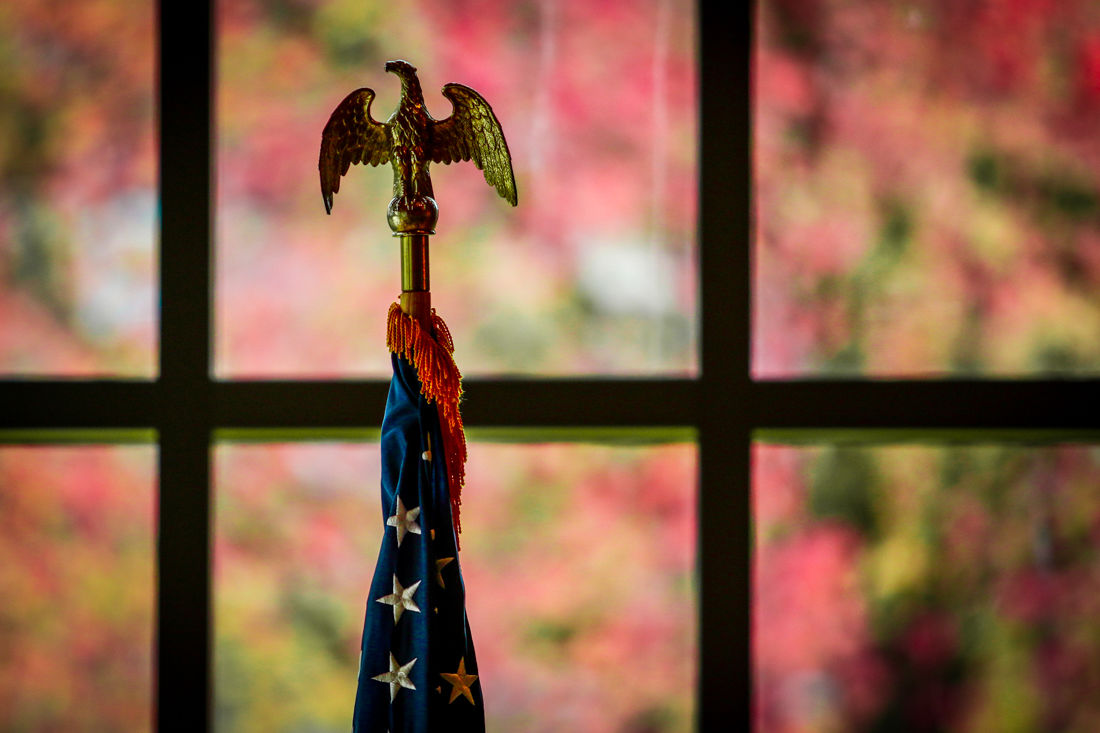 The American Flag in front of a fall background. (Samuel Marshall/Emerald)