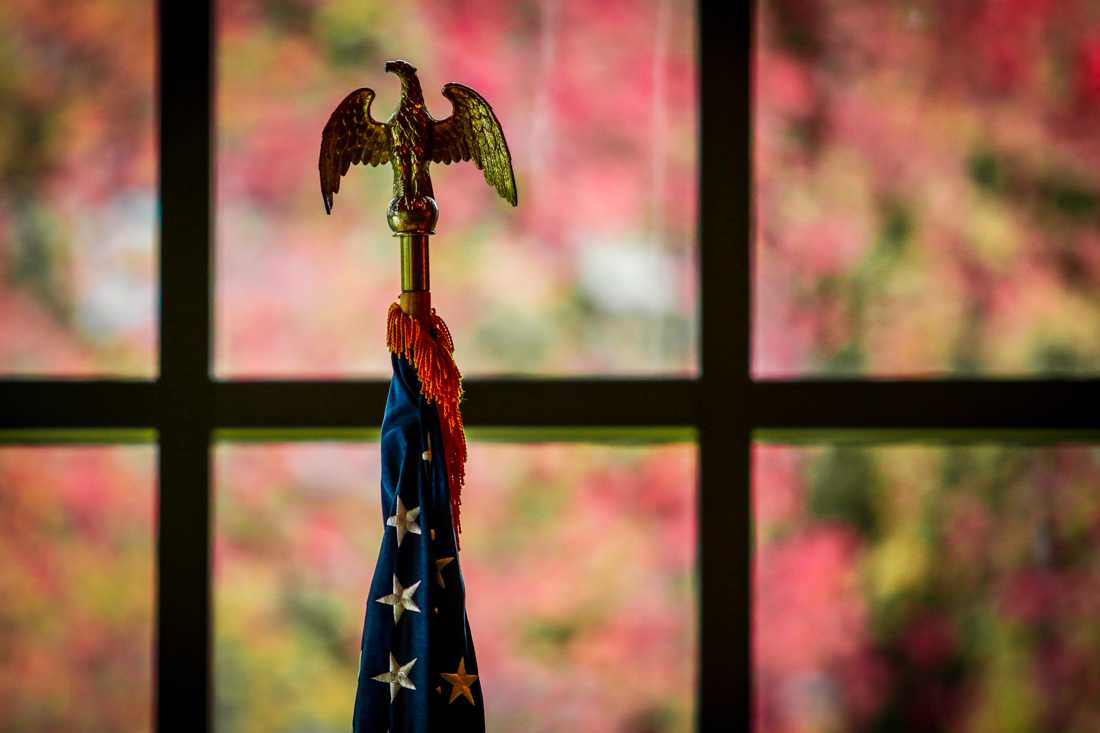 The American Flag in front of a fall background. (Samuel Marshall/Emerald)