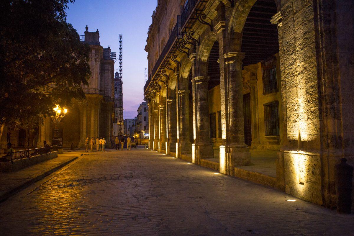 (Photo courtesy of Andy Abeyta) In the distance, tourists walk among streets mingling with locals enjoying a night out as well as vendors and other workers that inhabit the streets of Old Habana as seen on Sunday, March 22, 2015. The old district of Habana displays a wide variety of forms of architecture reflecting upon the varying influences from around the world that compound and expand the culture of the central Cuban city.