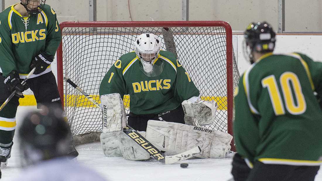 Oregon goaltender Ben Green (1) reaches to make a save. The Oregon Ducks face the Washington Huskies in game 4 of the I-5 Cup at the Lane County Ice Center in Eugene, Ore. on Jan. 23 2016. (Adam Eberhardt/Emerald)