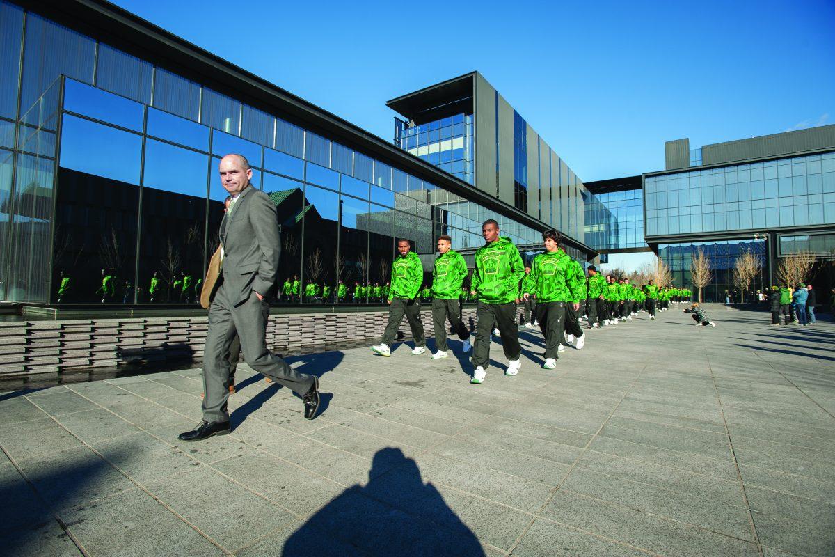 Oregon Ducks head coach Mark Helfrich walks the team out of the Hatfield Dowlin Complex. The No. 18 Oregon Ducks face the Oregon State Beavers in the Civil War at Autzen Stadium in Eugene, Ore. on Nov. 27, 2015. (Cole Elsasser/Emerald)