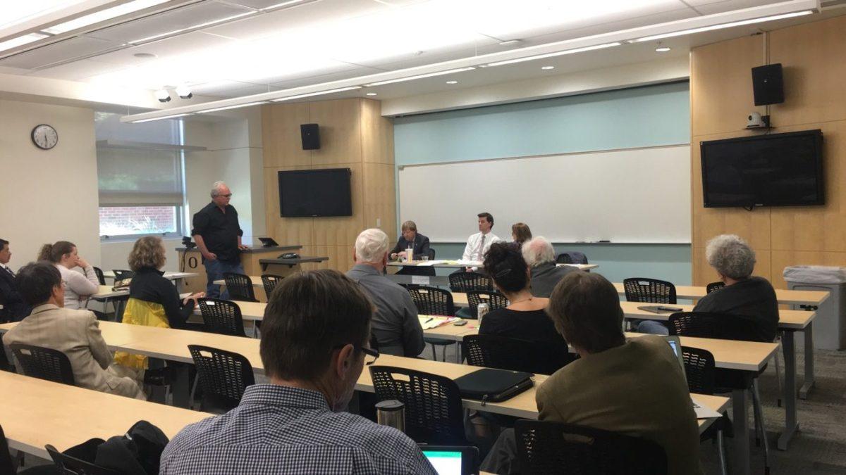 <p>University of Oregon professor Bill Harbaugh is asking the task force about its authority on changing the state laws (Tran Nguyen/Emerald)</p>