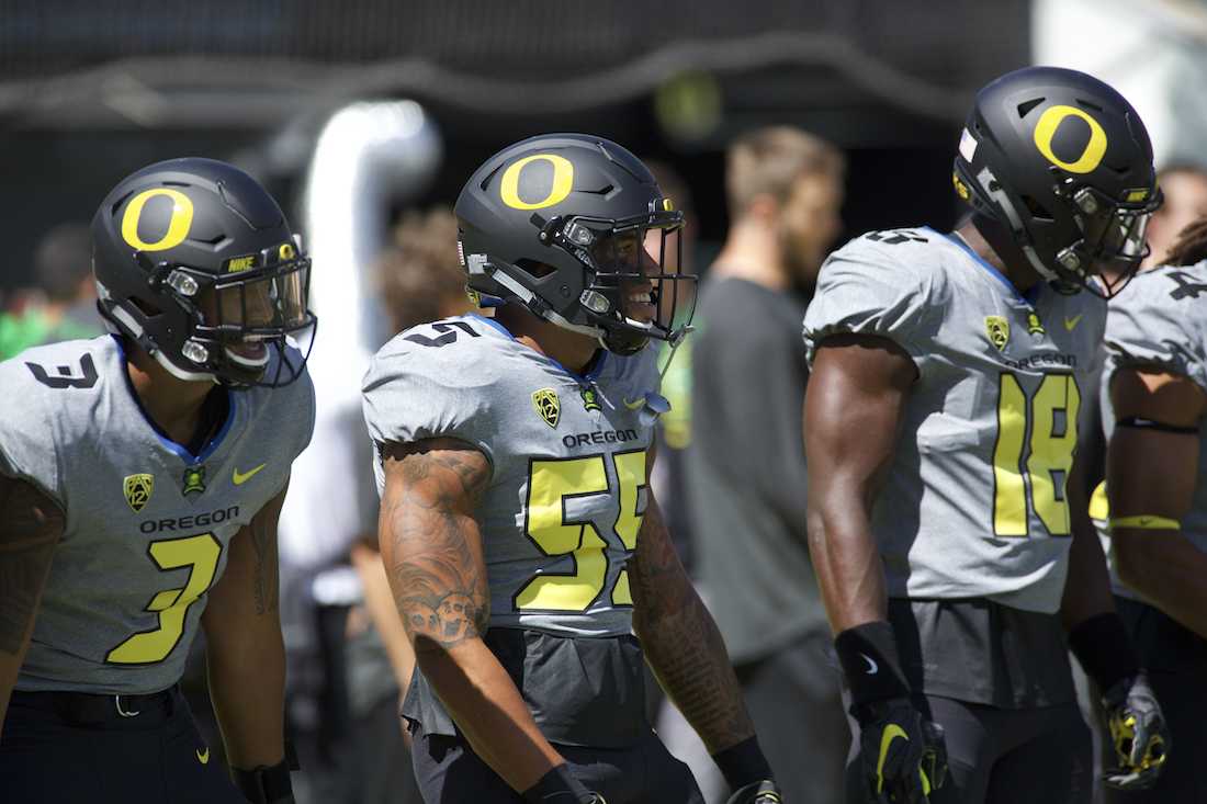 <p>Oregon Ducks linebacker Jonah Moi (3) laughs with fellow linebacker A.J. Hotchkins (55) during warmups. The No. 24 Oregon Ducks play the UC Davis Aggies for the season opener at Autzen Stadium in Eugene, Ore. on Sept. 3, 2016. (Eric Cech/Emerald)</p>