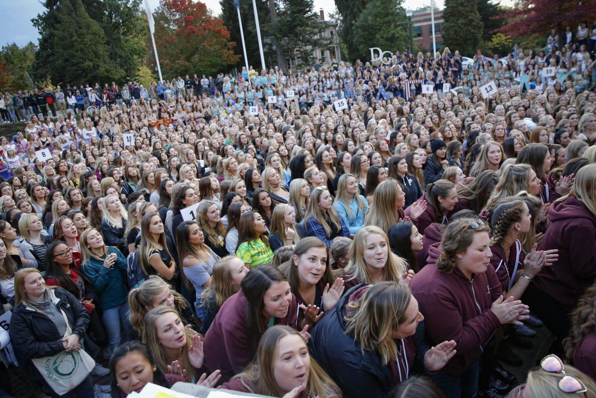 The seniors of each sorority and the incoming sisters gather together at the EMU Amphitheater for bid day on Oct. 4, 2016. (Samuel Marshall/Emerald)