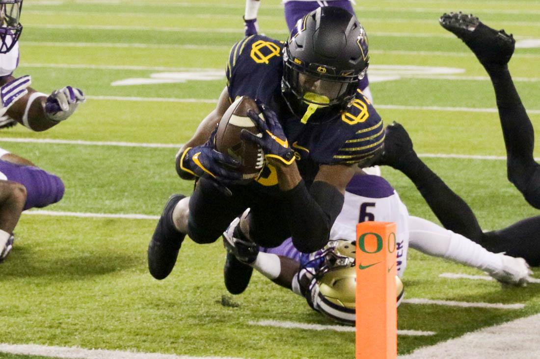 Oregon Ducks running back Taj Griffin (5) jumps into the end zone for a touchdown. The Oregon Ducks host the No. 5 Washington Huskies at Autzen Stadium in Eugene, Ore. on Oct. 8, 2016. (Kaylee Domzalski/Emerald)