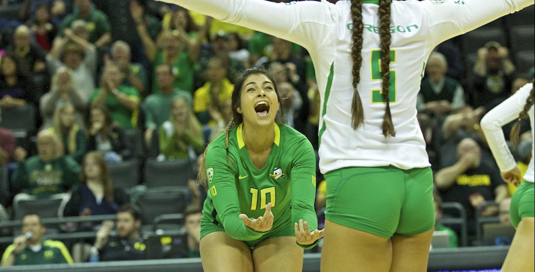 Oregon Ducks liberos Amanda Benson (10) and Brooke Van Sickle (5) celebrate a point win. Oregon volleyball plays the University of Washington on Friday, October 7th at Matthew Knight Arena in Eugene, Oregon. Eric Cech/Emerald