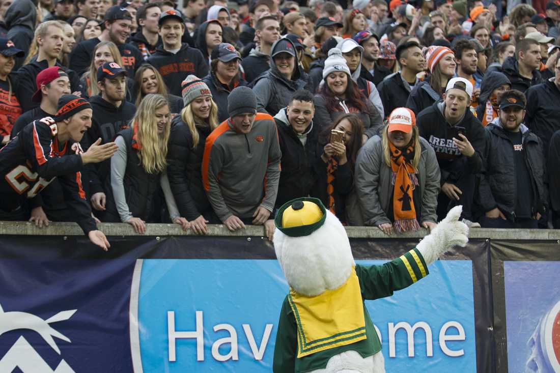 The Oregon Duck points toward the score board as it his heckled by Oregon State fans. The Oregon Ducks play the Oregon State Beavers in the 120th Civil war at Reser Stadium in Corvallis, Ore. on Saturday, Nov. 26, 2016. (Adam Eberhardt/Emerald)