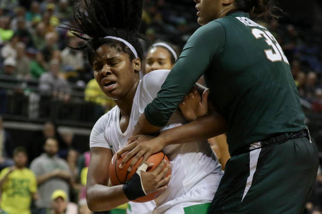 Oregon Ducks forward Ruthy Hebard (24) struggles to keep the ball away from Michigan State Spartans forward Taya Reimer (32). The Oregon Ducks play the No. 24 Michigan State Spartans at Matthew Knight Arena in Eugene, Ore. on Tuesday, Nov. 22, 2016. (Kaylee Domzalski/Emerald)