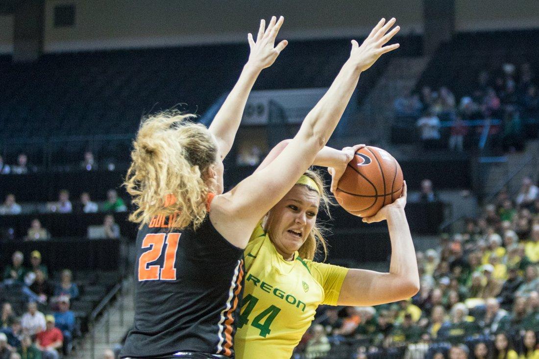 Oregon Ducks forward Mallory McGwire (44) attempts to pass the ball around Oregon State Beavers forward Marie G&#252;lich (21). The Oregon Ducks host the Oregon State Beavers in the first Civil War matchup of the weekend at Matthew Knight Arena in Eugene, Ore., on Friday January 27, 2017. (Aaron Nelson/Emerald)