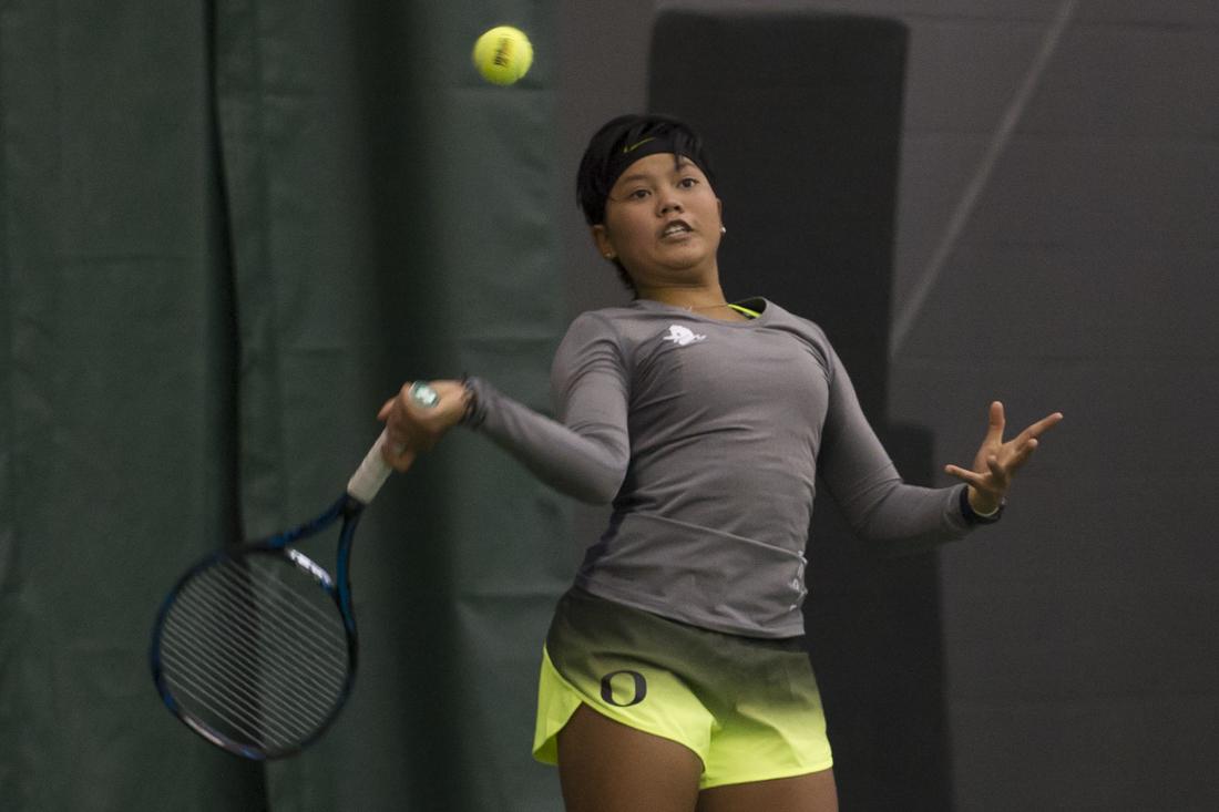 Rifanty Dwi Kahfiani hits the ball back to her opponent. The Oregon Ducks play Eastern Washington Eagles at the Oregon Student Tennis Center in Eugene, Ore. on January 21, 2017. (Adam Eberhardt/Emerald)