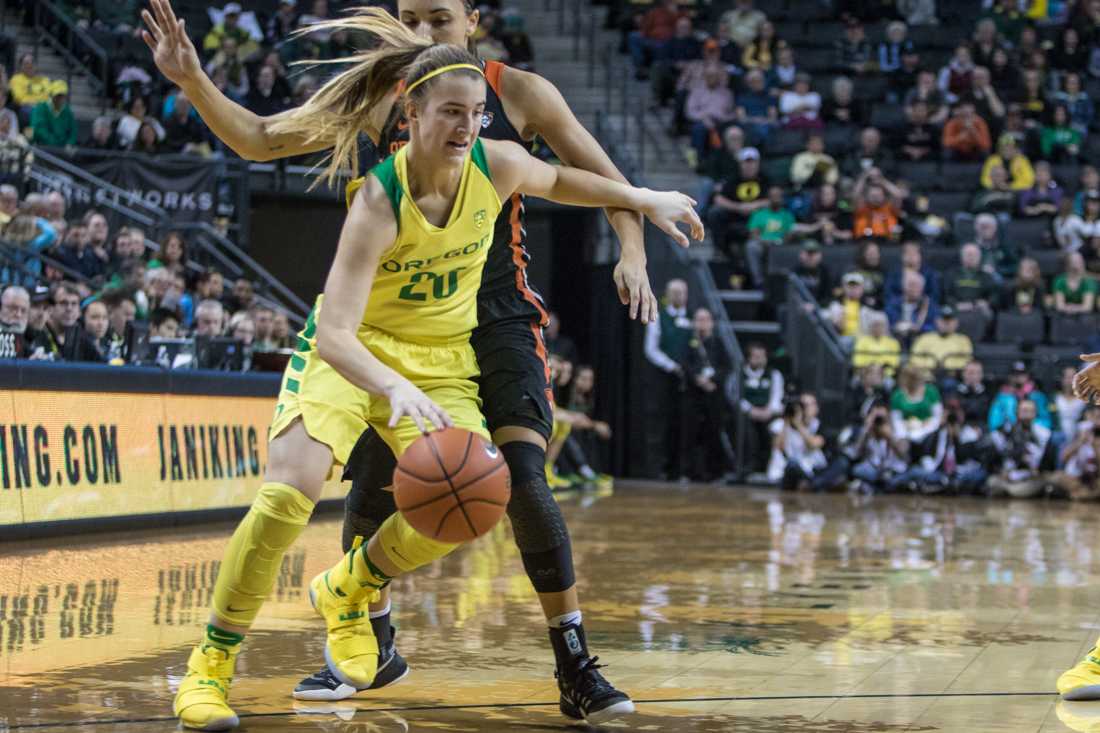 Oregon Ducks guard Sabrina Ionescu (20) drives past Oregon State Beavers guard Gabriella Hanson (11). The Oregon Ducks host the Oregon State Beavers in the first Civil War matchup of the weekend at Matthew Knight Arena in Eugene, Ore., on Friday January 27, 2017. (Aaron Nelson/Emerald)