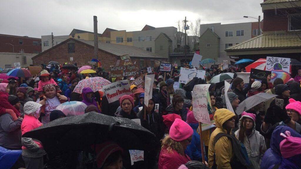 <p>Thousands of community members march across W. 8th Avenue. (Anna Lieberman/Emerald)</p>