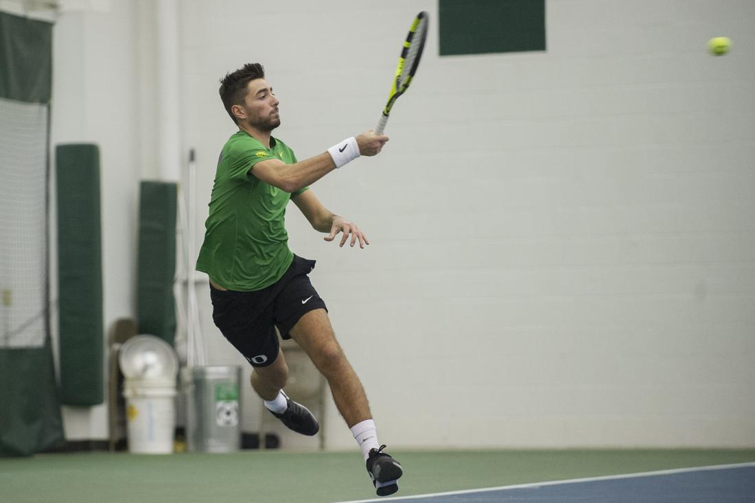 Thomas Laurent returns the ball to his opponent during his singles match. The Oregon Ducks play Montana State Bobcats at the Oregon Student Tennis Center in Eugene, Ore. on Sunday, January 22, 2017. (Adam Eberhardt/Emerald)