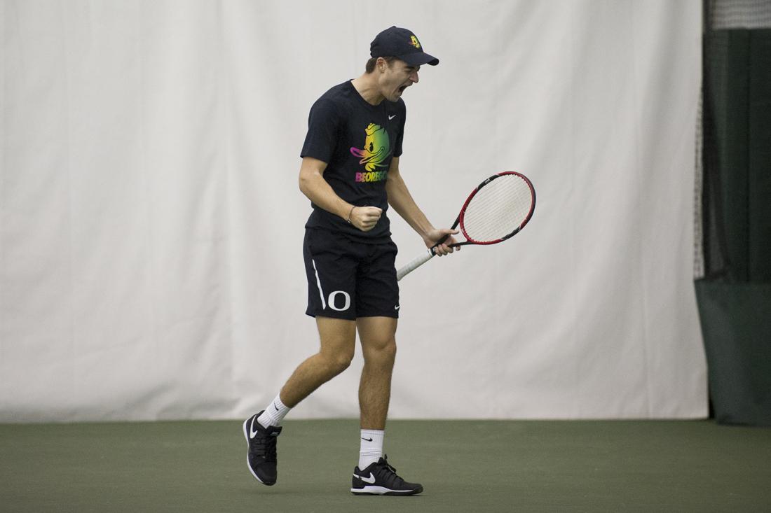 <p>Jayson Amos celebrates after scoring against his opponent during the singles round. The Oregon Ducks play the Iowa Hawkeyes at the Oregon Student Tennis Center in Eugene, Ore. on Saturday, February 11, 2017. (Adam Eberhardt/Emerald)</p>