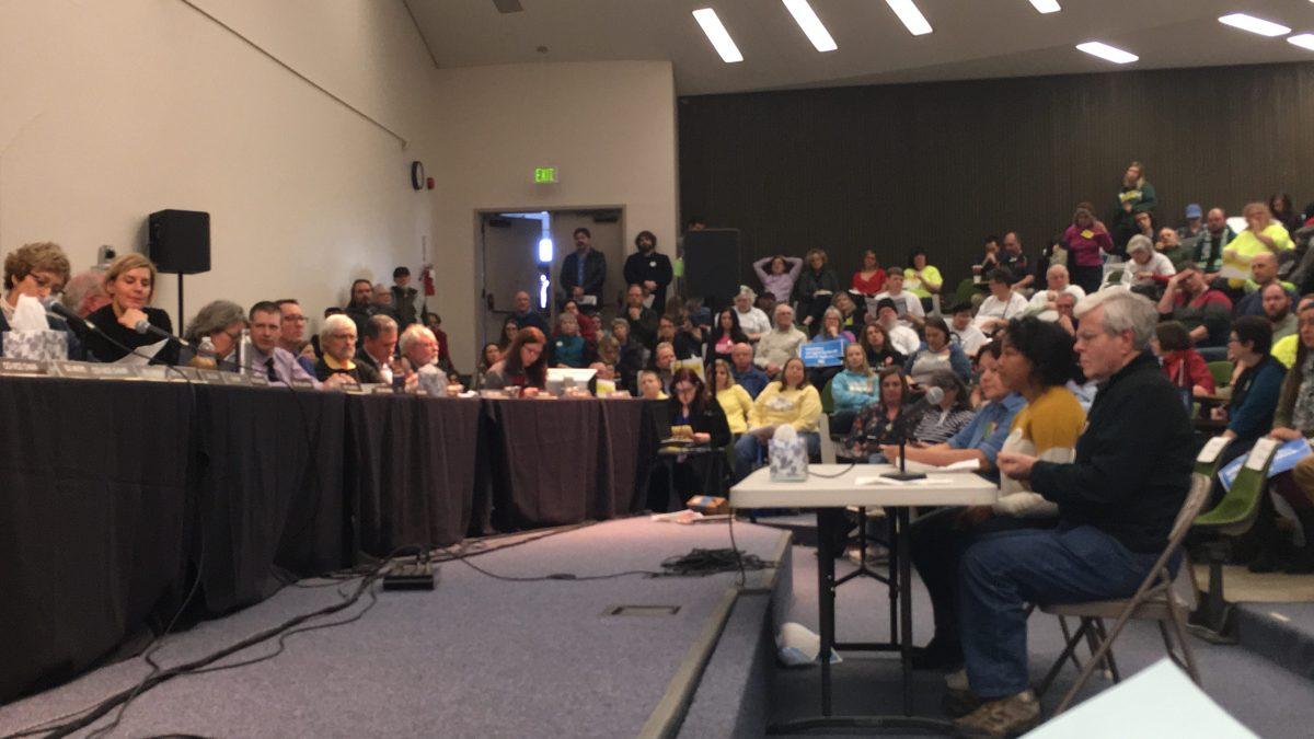 BOT member Kurt Wilcox, and UO freshman Amani Butler testify in from of Oregon&#8217;s Ways and Means Committee on Feb. 25 in the Lane Community College ballroom. (Andrew Field/Emerald)