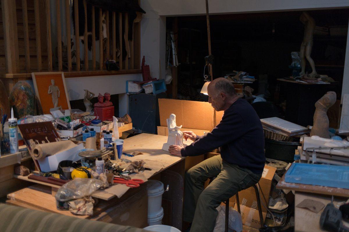 Eugene sculptor Mike Leckie crafts a sculpture in his workshop. (Savannah Mendoza/Emerald)